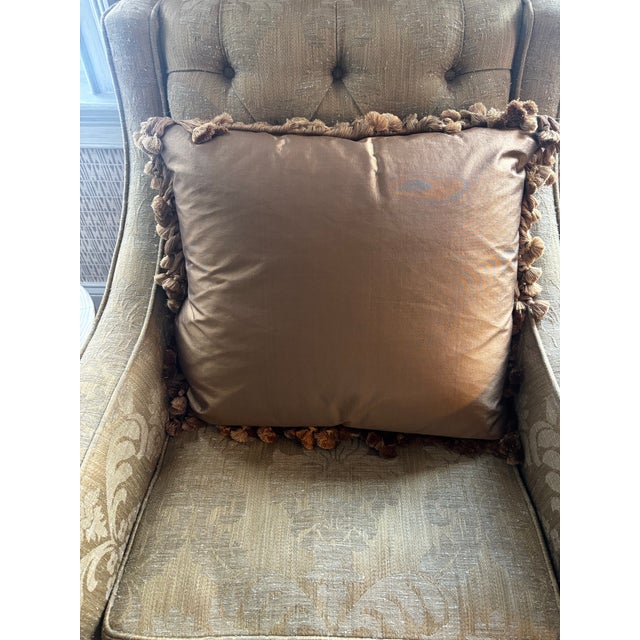 Golden silk pillow with cornucopia tapestry fragment front and silk trim w tassels.