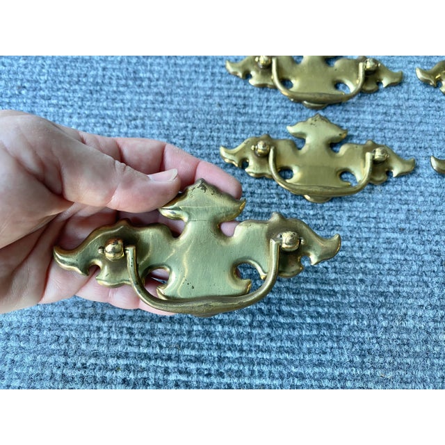 Gorgeous unlacquered brass Chippendale drawer pulls with 3" centers and attachment hardware included. Natural wear and...