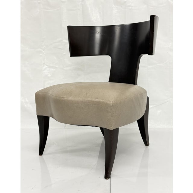 An elegant Klismos slipper chair by Donghia Furniture, designed and manufactured in the United States. Drawing inspiration...