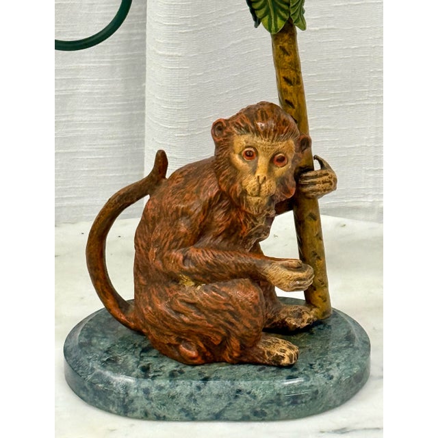 Introducing the charming "Petite Choses Vintage Monkey and Palm Tree Double Candlestick Holder"—a delightful piece that...