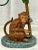 Introducing the charming "Petite Choses Vintage Monkey and Palm Tree Double Candlestick Holder"—a delightful piece that...