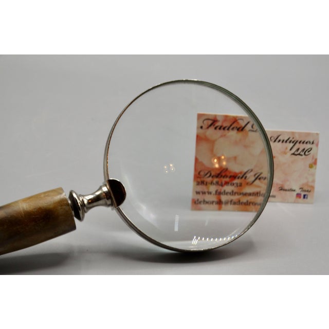 Nice quality silver and natural stag horn magnifying glass with new glass, probably Hilkinson. The horn is decorated with...