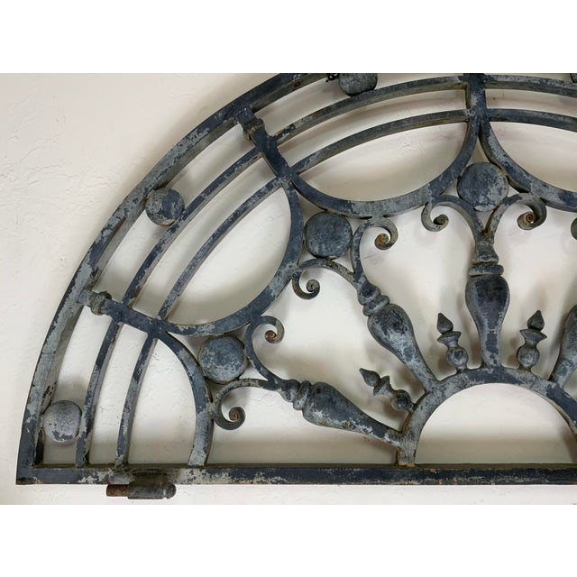 This spectacular cast iron transom has classic lines and shows beautiful scroll work. The lovely design features a center...