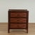 Handsome vintage British colonial stands crafted with faux burnt bamboo frames with three drawers, grasscloth panels all...