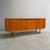 Remarks: Danish teak sideboard, 1960s. Teak veneer with four slide doors and three drawers. innersole is made from oak...