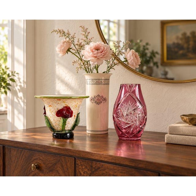 A decorative trio of vases combining rosy color, delicate florals, and contrasting textures. The collection includes a...