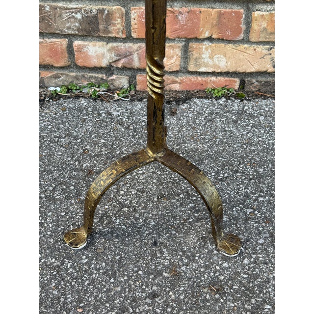 This is wonderful little Spanish made wrought iron drink table with an antiqued gold finish. It is contemporary yet...