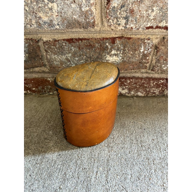 Vintage leather decorative box. This unique decorative accessory features an organic shaped box wrapped in a rich camel...