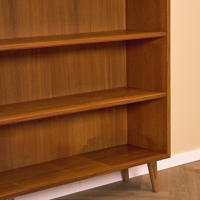 Bookshelf manufactured in Sweden in the 1950s-60s. It is made of teak veneer on the structure and solid beech wood in the...