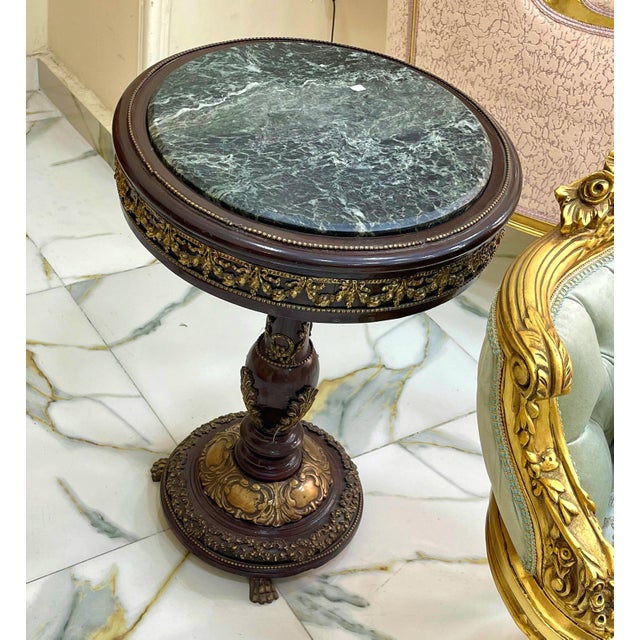 Bring timeless French elegance into your home with this exquisite Louis XVI-inspired round side table. Crafted from...
