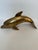 Bring a touch of coastal elegance and mid-century charm to your space with this vintage solid brass dolphin figurine. This...