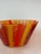 An exceptional vintage Swedish art glass bowl and vase set by Kosta Boda, showcasing bold hand-blown striping in fiery...