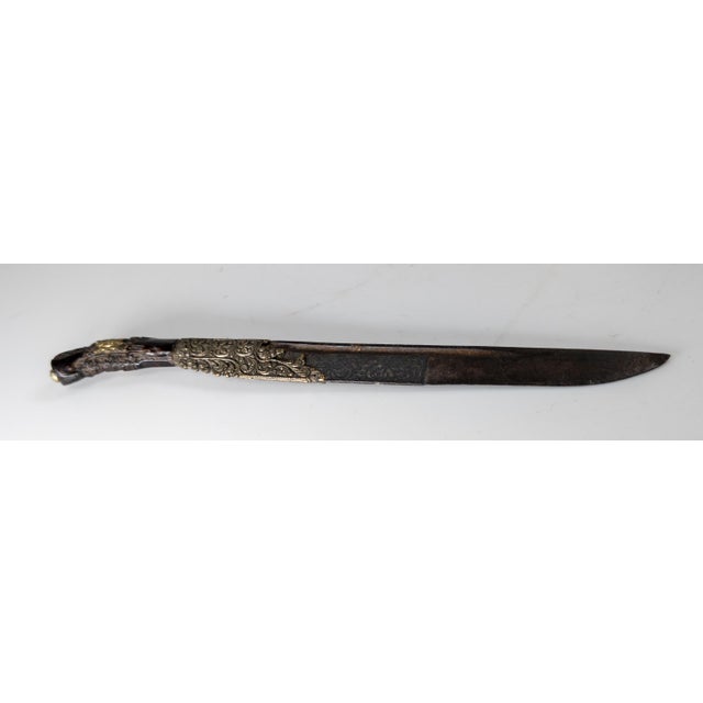 We are selling this fine and early example of a Piha Kaetta dagger. This dagger has foliate scrolled hanlde in dark...