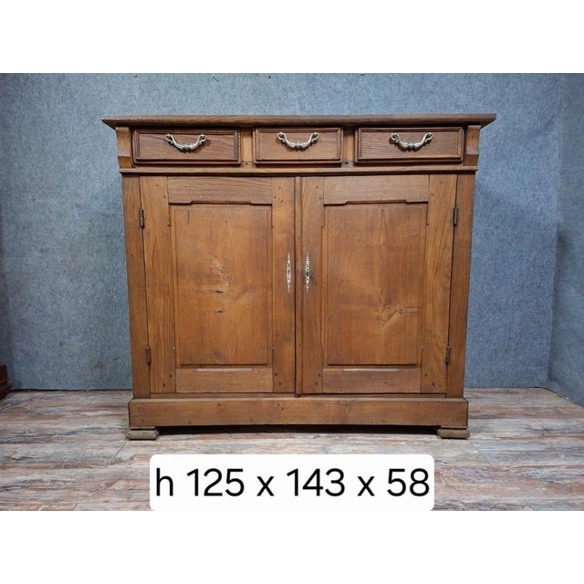 Antique solid wood sideboard, full of charm and character. this piece features two doors offering ample interior storage...