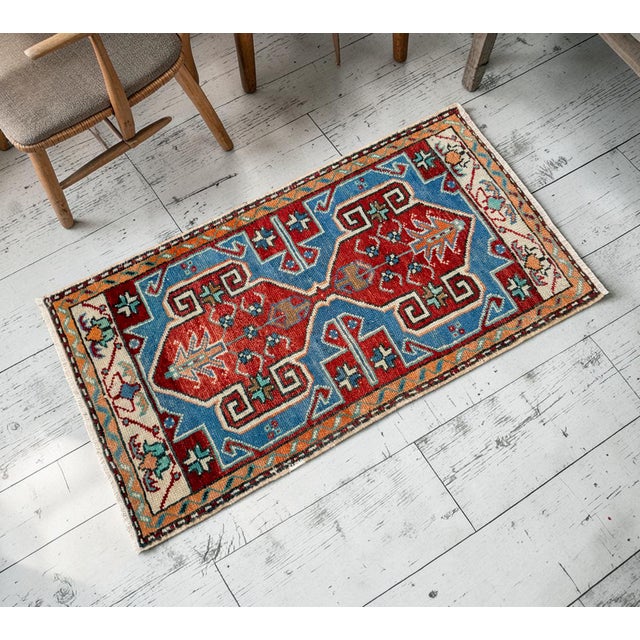 Welcome a touch of authentic Anatolian charm into your home with this striking vintage Chal rug. Perfectly sized as an...