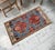 Welcome a touch of authentic Anatolian charm into your home with this striking vintage Chal rug. Perfectly sized as an...