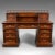 This is a grand antique executive desk. An English, satinwood and mahogany 13 drawer office desk, dating to the mid...