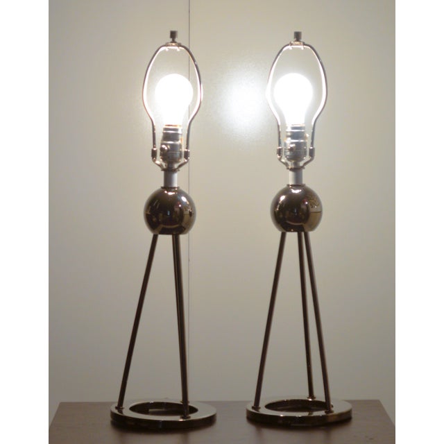 Nessen Tripod Polished Nickel Chrome Table Lamps Set of 2. Round base form supported by rodded globe. They are used in...