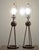 Nessen Tripod Polished Nickel Chrome Table Lamps Set of 2. Round base form supported by rodded globe. They are used in...