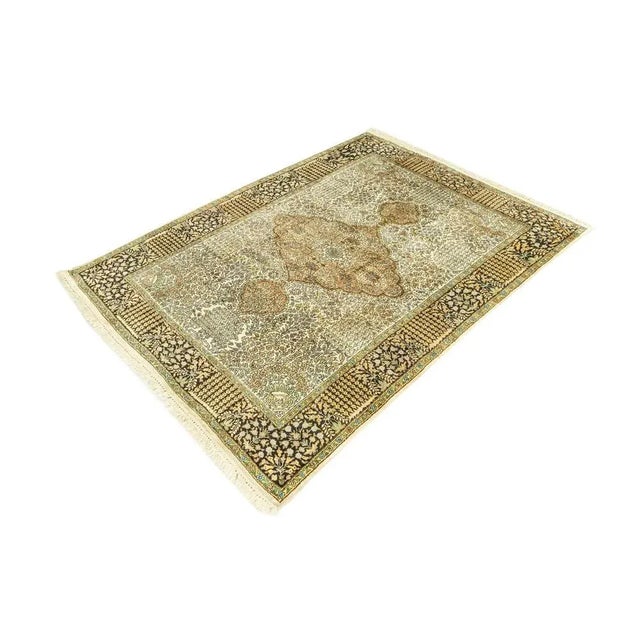 Cashmere Rug from the 1960s. The silk allows for detailed floral patterns and gives the rug a wonderful shimmering sheen....