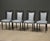 A set of four mid century modern solid beech deep mahogany color dining chairs with light blue vinyl fabric and restored...
