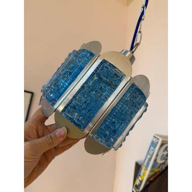 Scandinavian lighting design in a compact format: This blue and silver pendant lamp from the traditional Danish...