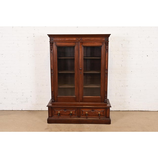 An exceptional antique Eastlake Victorian stepback bookcase cabinet In the manner of Herter Brothers USA, Circa 1880s...