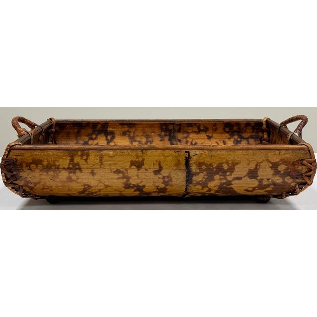 Vintage rich finish tortoise shell split bamboo and rattan serving tray. Features wrapped handles to each end and four (4)...