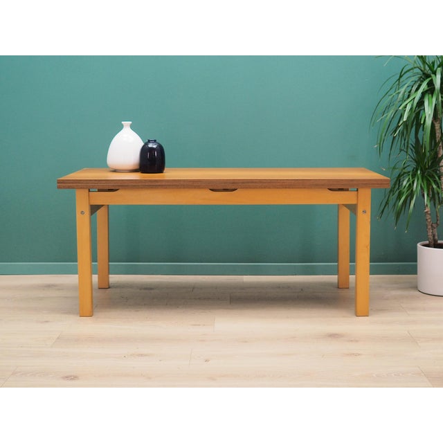 The table was made in the 1980s. It was produced by the Olsztyn Furniture Factory. The structure and top of the table are...