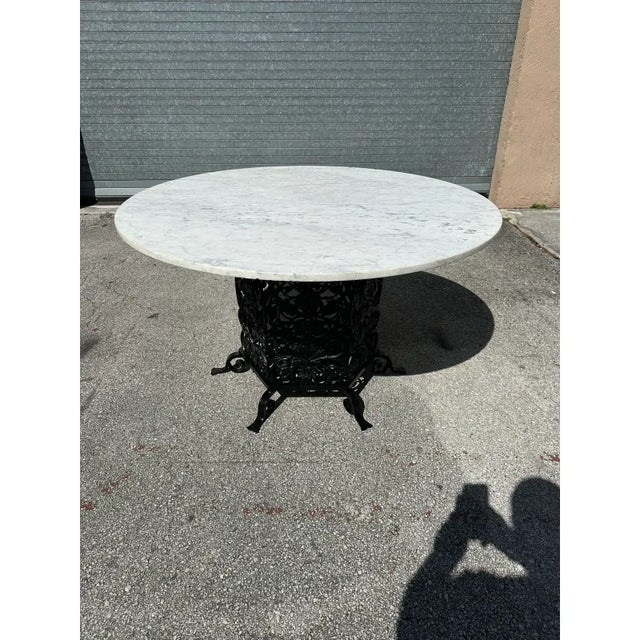 1french art deco bistro table or dining table featuring a large round shape Carrara marble top. The Italian marble top is...