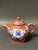 ITEM NAME: Chinese Art Yixing Teapot and Enamel Flower Design ORIGIN: China AGES: Late 20th Century MATERIALS: Yixing Clay...