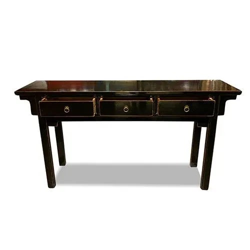 Asian black lacquer apron design console table is made out of elm wood. It has 3 drawers. It can use behind the sofa or...