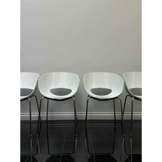 Amazing condition with normal vintage wear Striking vintage dining chairs from the 1970s featuring sculptural white molded...