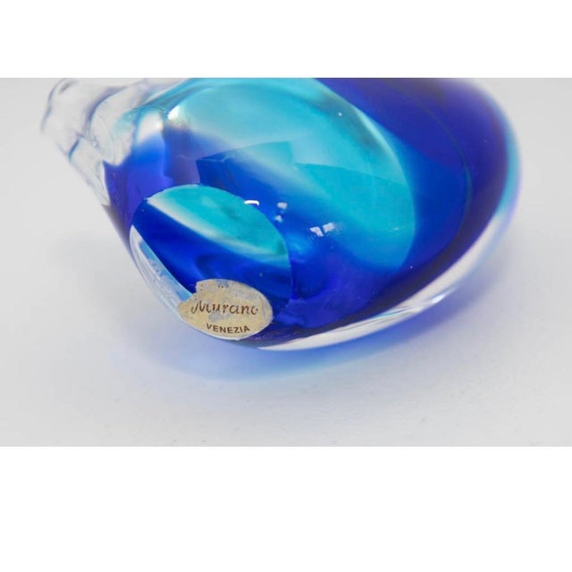 A graceful vintage Murano glass swan with flowing sculptural lines and luminous blue art glass. Its elegant form and...