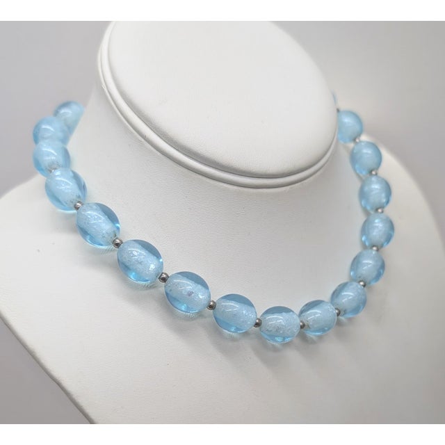 Early 1950s rhodium-plated baby blue ovoid glass beads with what looks like crystals down the centers with small round...