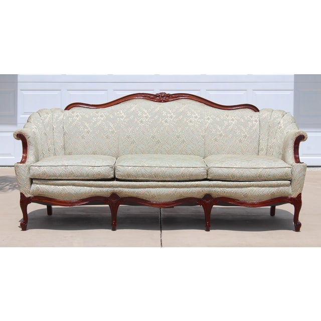 Enhance your interior with this elegant vintage French Provincial sofa settee by Fogle Furniture Co., beautifully crafted...