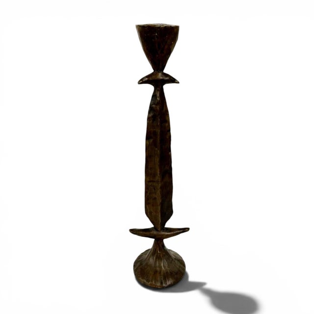 A pair of Brutalist bronze candlesticks from renowned sculptor Tom Corbin. The Totem candlesticks are beautifully crafted...