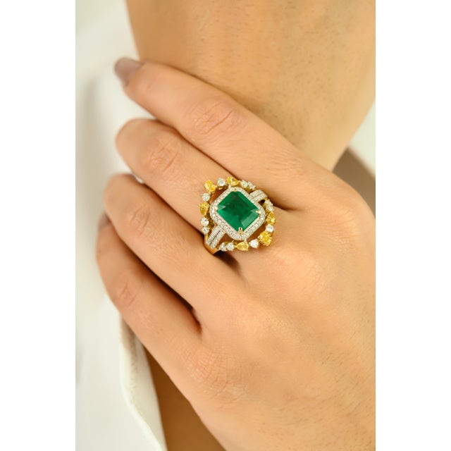 Radiating elegance and grandeur, this stunning cocktail ring is crafted in 14k yellow gold and showcases a striking 2.53...