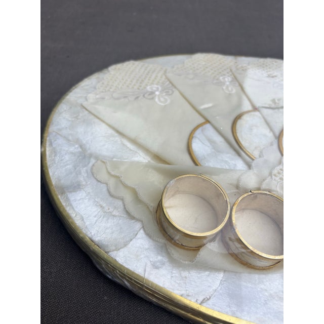 Elevate your table with this beautiful new old stock (NOS) vintage Capiz shell dining ensemble, preserved in its original...