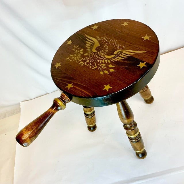 This is a traditional Americana dark stained pine wood 3-leg stool from the 1950s. I features a stride handle so it’s easy...