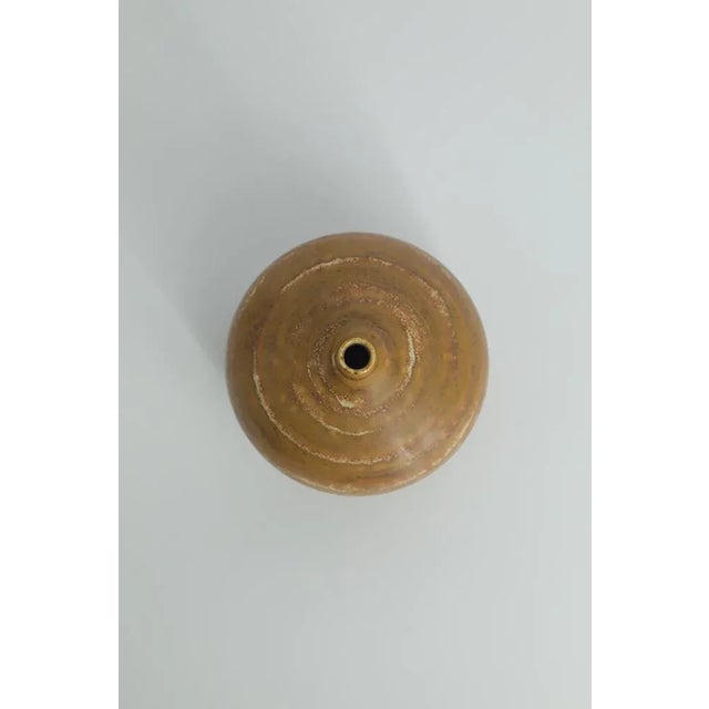 This miniature, collectible stoneware vase was designed by Gunnar Borg for the Swedish manufacture Höganäs Keramik during...