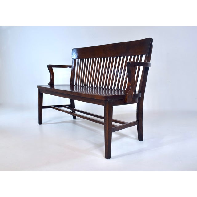 A rare and exceptional solid Birch banker or lawyer bench newly refinished. An interesting mid size silhouette allowing...