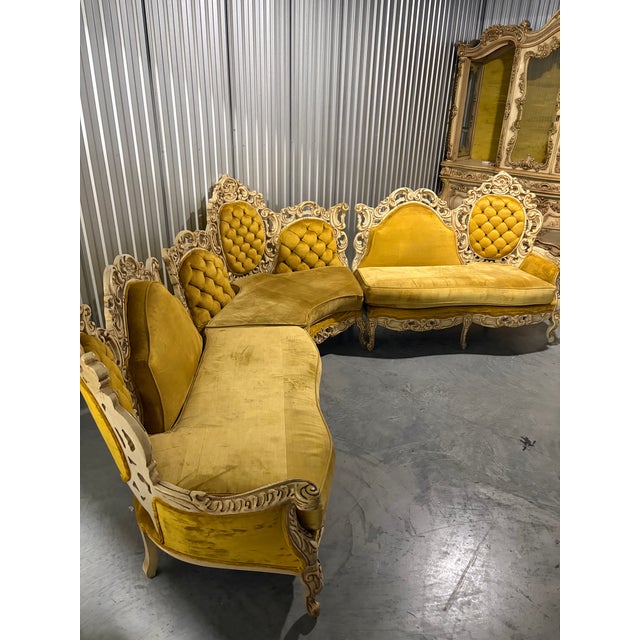 Spectacular vintage Rococo Revival sectional sofa featuring an elaborate carved wood frame, scrolling floral...