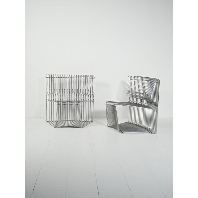 Pair of "Pantonova" armchairs by Verner Panton, 1971, manufactured by Fritz Hansen. Chromed steel frame with shaped...