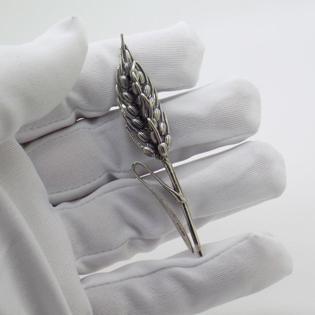This vintage silver decorative object depicts a life-size ear of corn figurine, crafted as a table centerpiece, vitrine...