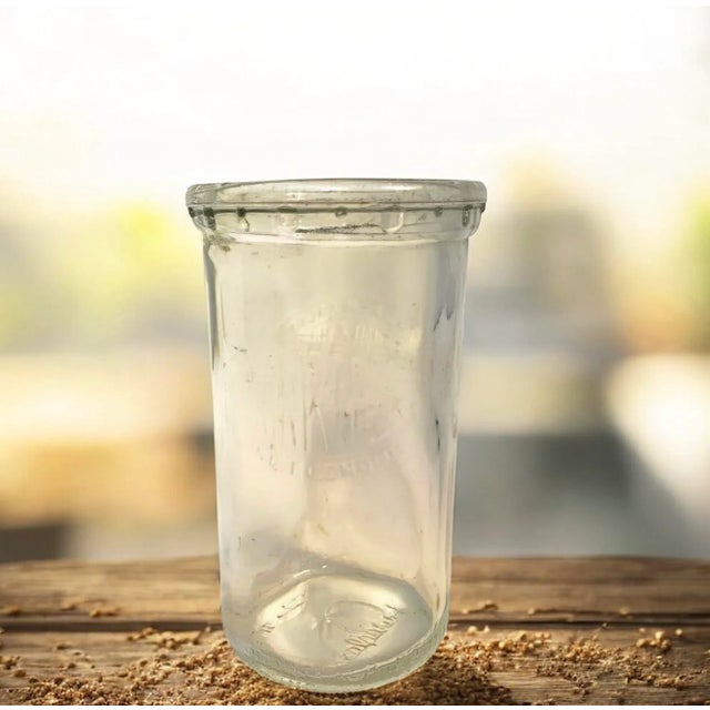This vintage Duraglas glass jar is embossed with the slogan “Drink Milk for Health and Economy” and marked “Property of...