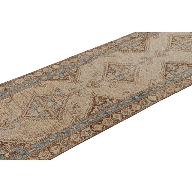 Hand-knotted in wool circa 1950-1960, this 3x14 vintage Turkish runner is inspired by Bakhtiari tribal rug designs. On the...