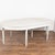 Early 20th-century Swedish Gustavian style expanding dining table crafted in pine with fluted, tapered legs. The table...