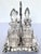 Produced in England in the late 1800s. This is an antique silver-plated caster or cruet set, likely from the Victorian...