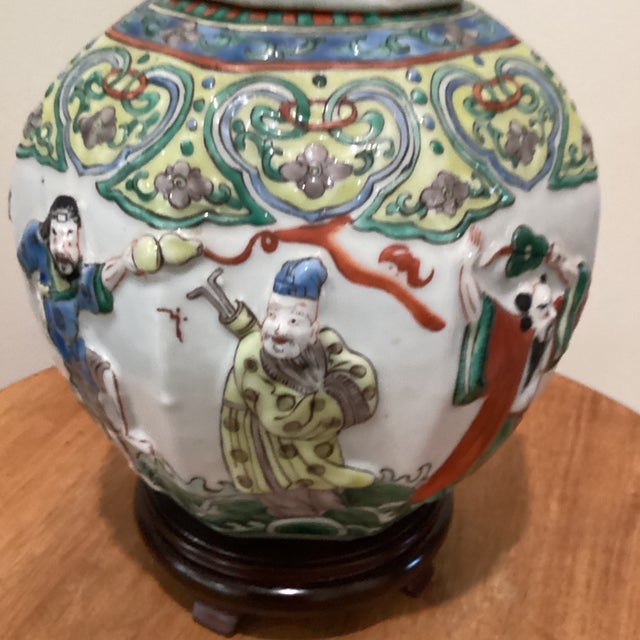 Antique Chinese Porcelain Ginger Jar With Molded Raised Eight Immortals on Wood Base For Sale - Image 4 of 12